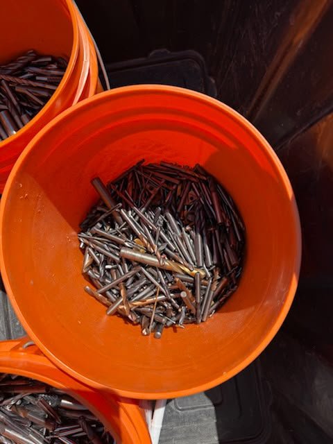 Carbide drill bits and round tooling collected for scrap quote review.