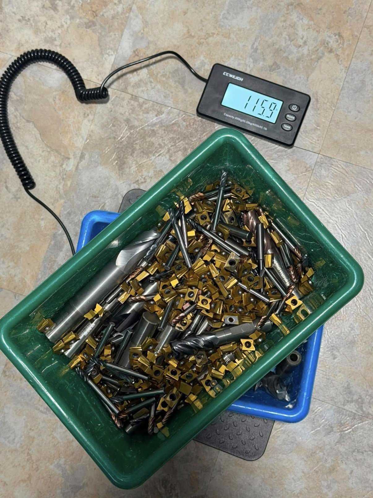 Carbide scrap weighed in a green bin for fast cash quote.